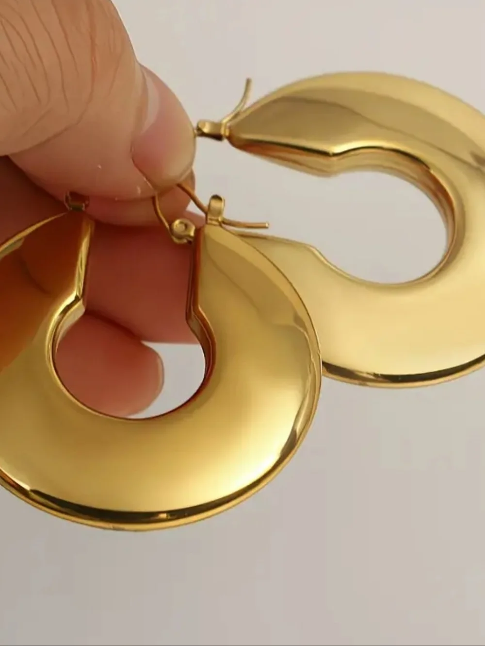 Chucky gold hoop earrings; 1.57